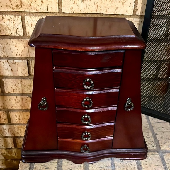 Vintage graduated jewelry box with multiple drawers